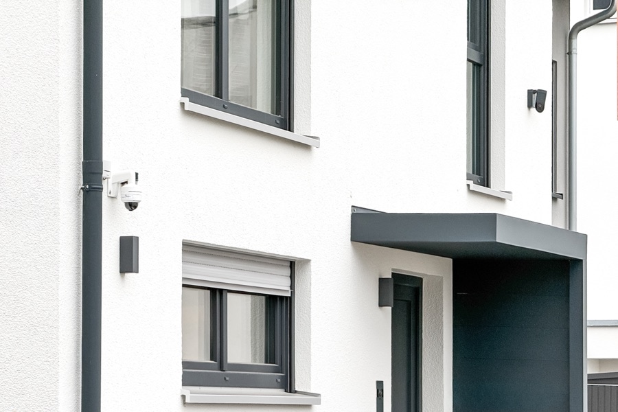 Modern home exterior protected by surveillance cameras